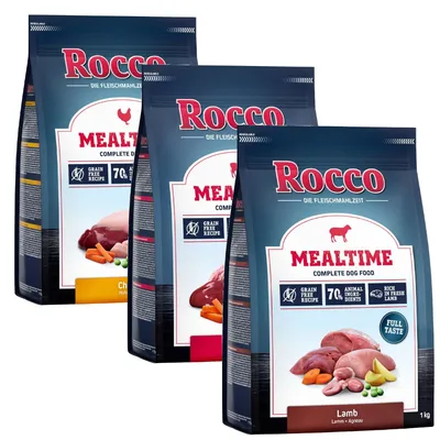 Rocco Mealtime Complete Dog Food, visible flavours include Lamb and Chicken, grain free recipe, 70% animal ingredients, rich in fresh lamb, 1kg bags shown.