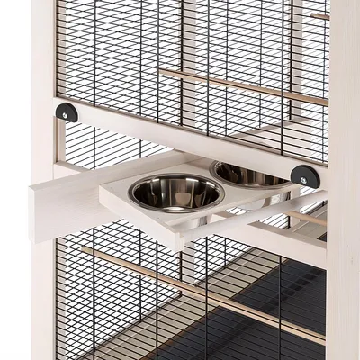 Wooden frame with two stainless steel bowls, integrated into a cage design with black grid walls and wooden bars.