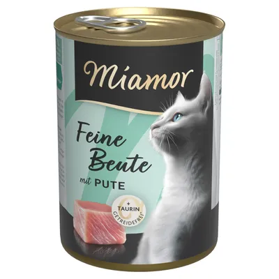 Miamor Feine Beute mit Pute, getreidefrei, mit Taurin. Abgebildet: Weisser Katzenkopf und Stück Putenfleisch auf der Dose.