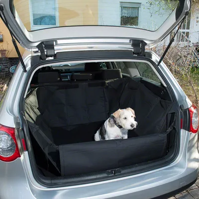 Svart bagageskydd för bil, heltäckande med upphöjda sidoväggar och frontsida. Lämplig för transport av husdjur eller bagage.