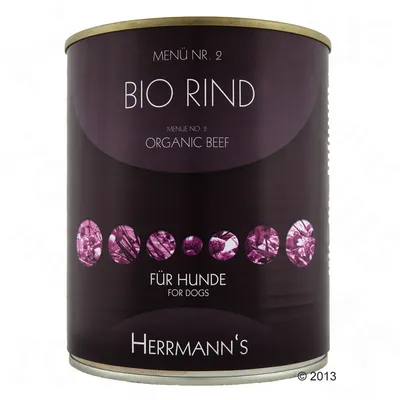 Lata de comida para perros Herrmann's, menú nº 2 Bio Rind, Organic Beef, Für Hunde, envase negro con detalles morados. Texto en alemán e inglés visible en la etiqueta.