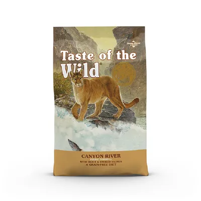 Taste of the Wild Canyon River Feline Formula with Trout & Smoked Salmon A Grain-Free Diet, confezione visibile con immagine di puma su sfondo naturale.