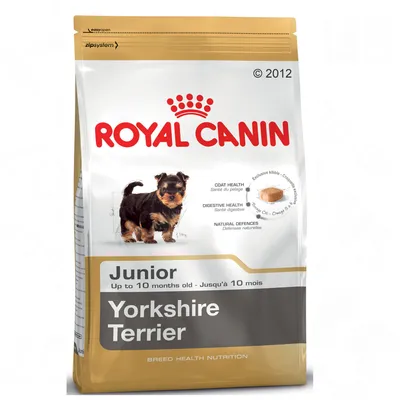 Product packaging for Royal Canin Junior Yorkshire Terrier, up to 10 months old. Highlights coat health, digestive health, natural defences and exclusive kibble shape.