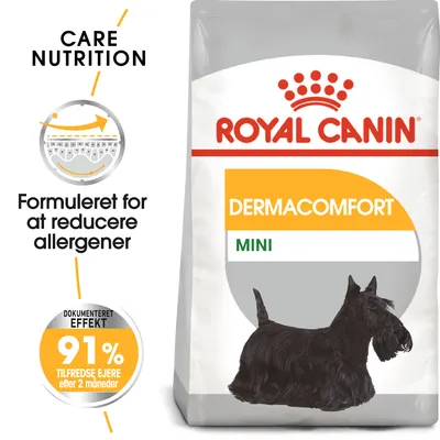 Royal Canin Dermacomfort Mini hundefoder. Tekst: Formuleret for at reducere allergener, dokumenteret effekt 91 % tilfredse ejere efter 2 måneder. Billede af sort hund.