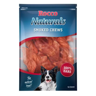 Rocco Naturals Smoked Chews, sachet de 10 friandises visibles, texte : 100% ears, The natural treat!, emballage refermable, illustration d’un chien en bas à gauche.