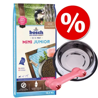 Set Bosch Mini Junior 15 kg, ciotola in metallo e osso rosa. Testo visibile: 'Immun Komplex', '26 Protein', '17 Fettgehalt', simbolo percentuale rosso per offerta.