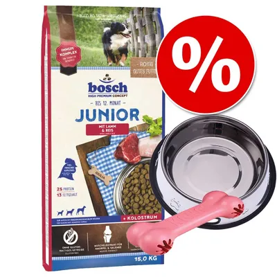 Confezione Bosch Junior mit Lamm & Reis 15 kg, ciotola in metallo, osso rosa gioco e simbolo percentuale rossa per offerta. Testo visibile: 25 Protein, 13 Fettgehalt, ohne glutenhaltiges Getreide.