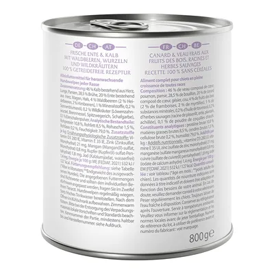 Tin labelled: Fresh duck & veal with forest berries, roots and wild herbs. 100% grain-free recipe. Complete food for growing small breed dogs. Content: 800g.