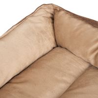 Primo piano di un letto per animali beige imbottito con superficie in tessuto morbido e lati rialzati.