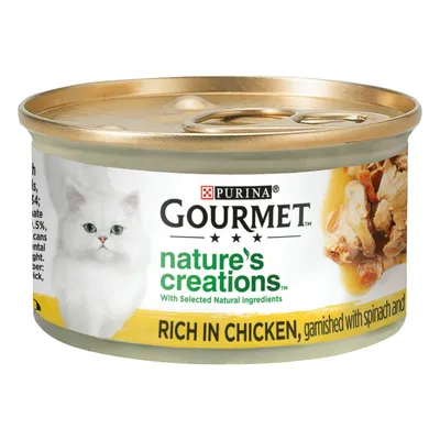 Gourmet Nature's Creations wet food, rich in chicken, garnished with spinach and visible natural ingredients, as shown on the can label.