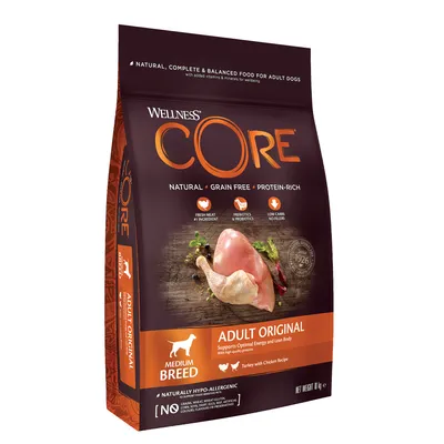 Bag labelled natural, grain free, protein-rich food for adult dogs, medium breed, adult original with turkey and chicken recipe. Highlights fresh meat, prebiotics, low carbs, hypo-allergenic.