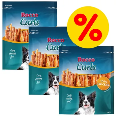 Three packs of Rocco Curls with 100% chicken, resealable packaging, and a yellow percentage discount symbol shown.