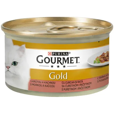 Purina Gourmet Gold puszka karmy dla kotów z indykiem i kaczką, złote opakowanie, ilustracja kawałków mięsa i białego kota.