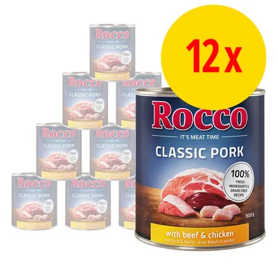 12 dåser Rocco Classic Pork med teksten 'with beef & chicken', 800 g, 100% fresh ingredients & grain-free recipe. Stor gul cirkel med rød tekst: 12x.
