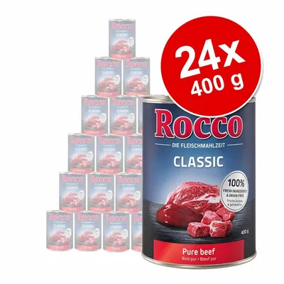 Set 24 conserve Rocco Classic Pure beef, 400 g fiecare. Etichetă: 100% fresh ingredients & grain-free. Imagine carne de vită pe ambalaj. Text suplimentar în germană și engleză.