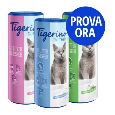 Tre confezioni di Tigerino Refresher Cat Litter Refresher, varianti rosa, blu e verde, con immagini di gatti. Cerchio blu con testo: PROVA ORA.