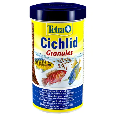 Boîte Tetra Cichlid Granules, aliment complet pour cichlidés. Texte visible : santé, croissance et couleurs éclatantes. Images de poissons colorés et granulés flottants. Boîte Tetra Cichlid Granules, aliment complet pour cichlidés. Texte visible : santé, croissance et couleurs éclatantes. Images de poissons colorés et granulés flottants.