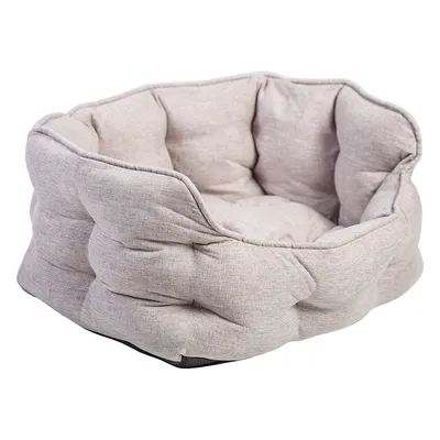Round, padded pet bed in light grey fabric look with raised edge.