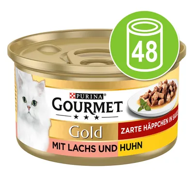 Purina Gourmet Gold, крехки хапки в сос с сьомга и пиле. Опаковката показва бяла котка и чиния с месо. Зелен символ: 48 консерви. Purina Gourmet Gold, крехки хапки в сос с сьомга и пиле. Опаковката показва бяла котка и чиния с месо. Зелен символ: 48 консерви.