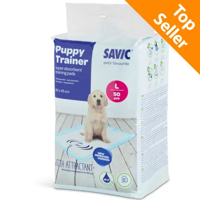 Confezione SAVIC Puppy Trainer super absorbent training pads, 60 x 45 cm, taglia L, 50 pezzi. Immagine di un cucciolo su tappetino. Testo: Top Seller, new improved version. Confezione SAVIC Puppy Trainer super absorbent training pads, 60 x 45 cm, taglia L, 50 pezzi. Immagine di un cucciolo su tappetino. Testo: Top Seller, new improved version.