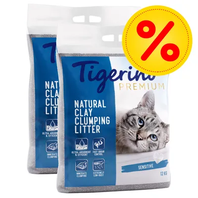Lot de 2 sacs Tigerino Premium Natural Clay Clumping Litter Sensitive, 12 kg chacun, texte anglais, symbole promotionnel pourcentage visible.