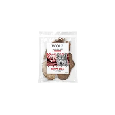 Sachet de friandises pour chien Wolf Wilderness High Valley, morceaux de viande séchée visibles à travers l’emballage, texte : HIGH VALLEY, 100 % viande, 150 g.
