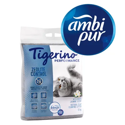 Tigerino Performance Zeolite Control, areia aglomerante de argila natural com aroma a jasmim branco, 12 kg. Inclui logótipos Febreze freshness e Ambi Pur. Gato cinzento visível na embalagem.