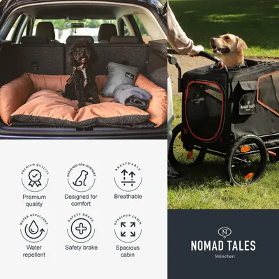 Cama para perro en maletero, carrito de transporte Nomad Tales con perro, texto visible: Premium quality, Designed for comfort, Breathable, Water repellent, Safety brake, Spacious cabin, Nomad Tales München.