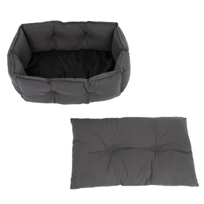 Cama cinzenta acolchoada para animais de estimação com almofada removível. Forma retangular, adequada para conforto e descanso.