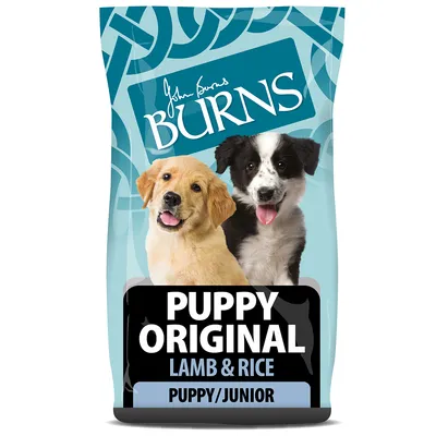 John Burns Puppy Original Cordero y Arroz, apto para cachorros y perros jóvenes. El envase muestra dos perros sobre fondo azul.