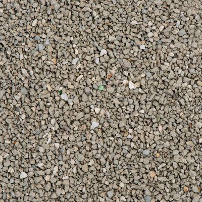Granuli grigi di lettiera per gatti, materiale minerale visibile. Nessun marchio o testo identificabile nell'immagine.
