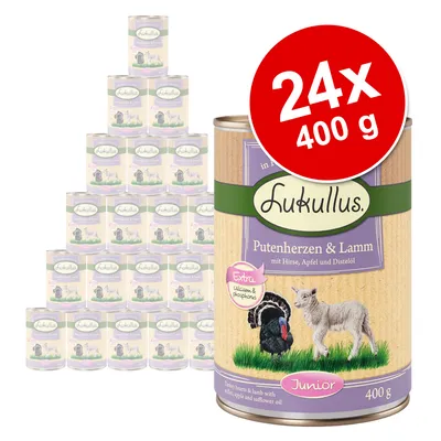 Zestaw 24 puszek Lukullus Putenherzen & Lamm Junior, każda 400 g. Widoczne opakowanie z ilustracją indyka i jagnięcia oraz napisem Extra calcium & phosphorus.