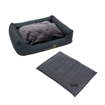 Panier pour chien en tissu gris avec coussin moelleux et couverture assortie, motif os visible. Pastille rouge avec texte : Prix mini.