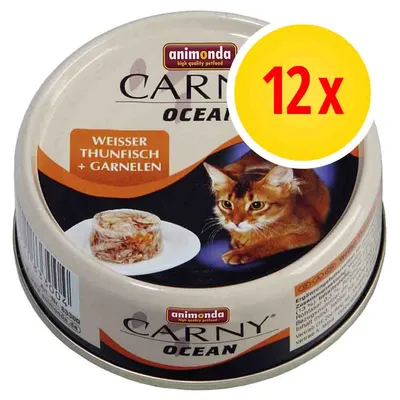 animonda Carny Ocean, WEISSER THUNFISCH + GARNELEN, confezione da 12x. Immagine di una scatoletta con gatto e porzione di cibo visibili sull'etichetta.