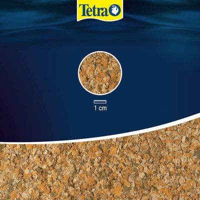 Tetra alimento en escamas, vista detallada de las escamas con escala: 1 cm.