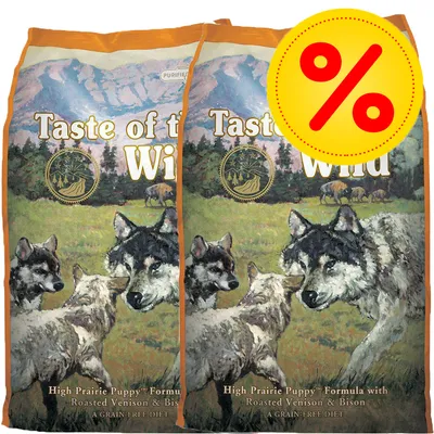 2 poser Taste of the Wild High Prairie Puppy Formula with Roasted Venison & Bison, A Grain-Free Diet. Stor gul procent-tegn badge øverst til højre.