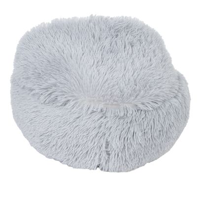 Cuscino rotondo e soffice di colore grigio chiaro con superficie morbida. Adatto come comoda area per sdraiarsi.