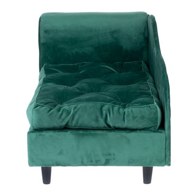 Green upholstered furniture with velvet cover and black wooden legs, suitable as a lying surface.