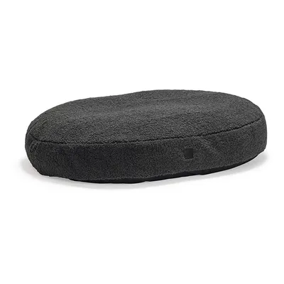 Coussin ovale pour animal, tissu gris foncé à texture douce, sans motifs ni éléments décoratifs visibles.