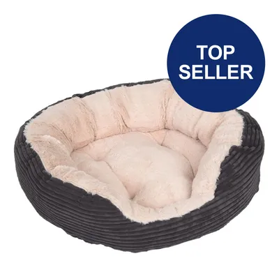 Rundes Haustierbett mit weicher, beiger Plüschpolsterung und dunkelgrauem geripptem Aussenmaterial. Blauer Kreis mit weisser Aufschrift 'Top Seller'. Rundes Haustierbett mit weicher, beiger Plüschpolsterung und dunkelgrauem geripptem Aussenmaterial. Blauer Kreis mit weisser Aufschrift 'Top Seller'.