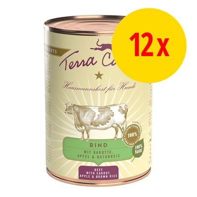Lot de 12 boîtes Terra Canis Rind mit Karotte, Apfel & Naturreis, texte visible : beef with carrot, apple & brown rice, 100 % natur. Illustration de vache sur l’étiquette.