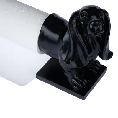 Schwarzer Hundehalter für Küchenpapierrollen, dekoratives Design mit Hundeskulptur.