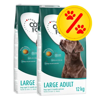 Lot de 2 sacs de croquettes pour chien adulte grande taille, 12 kg chacun, texte visible : LARGE ADULT, Dogs aged 15 months and over, promotion indiquée par un symbole pattes et pourcentage.