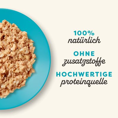 100% natürlich, ohne Zusatzstoffe, hochwertige Proteinquelle. Abgebildet ist eine Portion des Produkts auf einem blauen Teller.