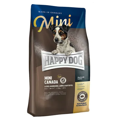 Confezione Happy Dog Mini Canada, salmone, coniglio, agnello e patate. Senza cereali. Small bits per cani di piccola taglia. Made in Germany. Testo anche in inglese e tedesco.