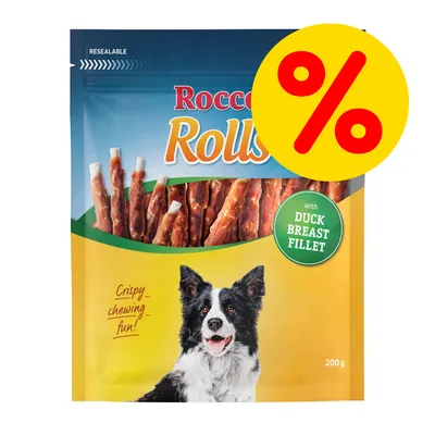 Rocco Rolls hundgodis 200 g, med texten 'with duck breast fillet', stor gul rabatt-symbol med procenttecken, bild på hund och synliga godispinnar i förpackningen. Rocco Rolls hundgodis 200 g, med texten 'with duck breast fillet', stor gul rabatt-symbol med procenttecken, bild på hund och synliga godispinnar i förpackningen.