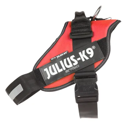 JULIUS-K9 IDC POWER sele i sort og rød med synlig tekst: 'IDC by JULIUS-K9', 'JULIUS-K9', 'IDC POWER'. Sort spænde og metalring synlige.