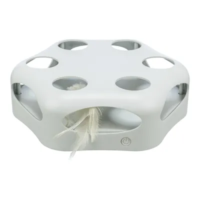 Bela plastična igrača s šestimi odprtinami in peresom, vidnim skozi eno odprtino. Spredaj je gumb za vklop/izklop. Bela plastična igrača s šestimi odprtinami in peresom, vidnim skozi eno odprtino. Spredaj je gumb za vklop/izklop.