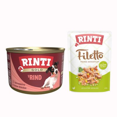 RINTI Gold mit Geflügelherzen, getreidefrei, in feinen Stücken. Abbildung einer Dose mit Hund auf der Verpackung.