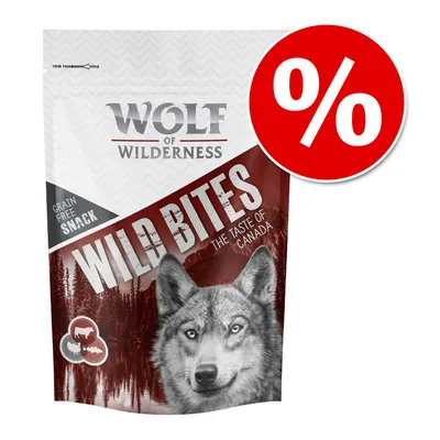 Wolf of Wilderness Wild Bites The Taste of Canada, Grain Free Snack. Opakowanie z wizerunkiem wilka i czerwonym symbolem procentowym oznaczającym promocję.